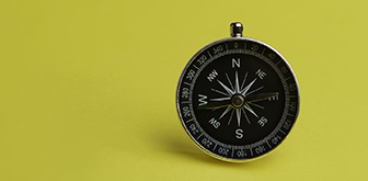 compass on a yellow background
