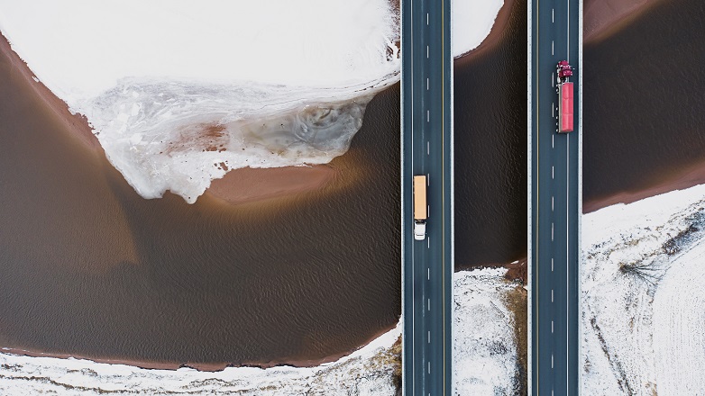 lorry trucks crossing bridges over ice