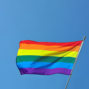 rainbow flag on blue sky